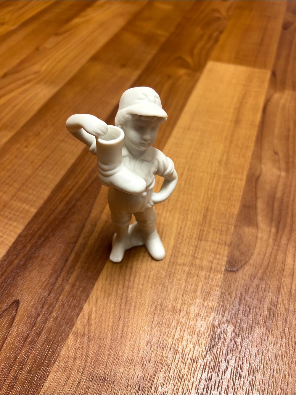 White Porcelain Boy Figurine Holding Boot